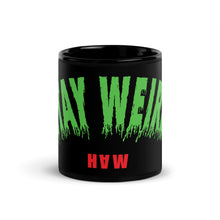 Black mug with ‘Stay Weird’ print.
