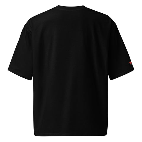 Front view of white oversized T-shirt with Stay Weird print in green