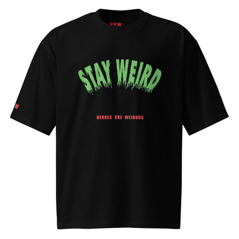 Stay Weird printed on a black oversized T-shirt 